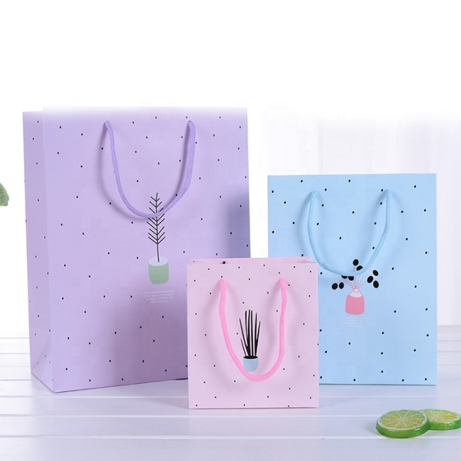 China manufactures customized pink lining bag gift paper